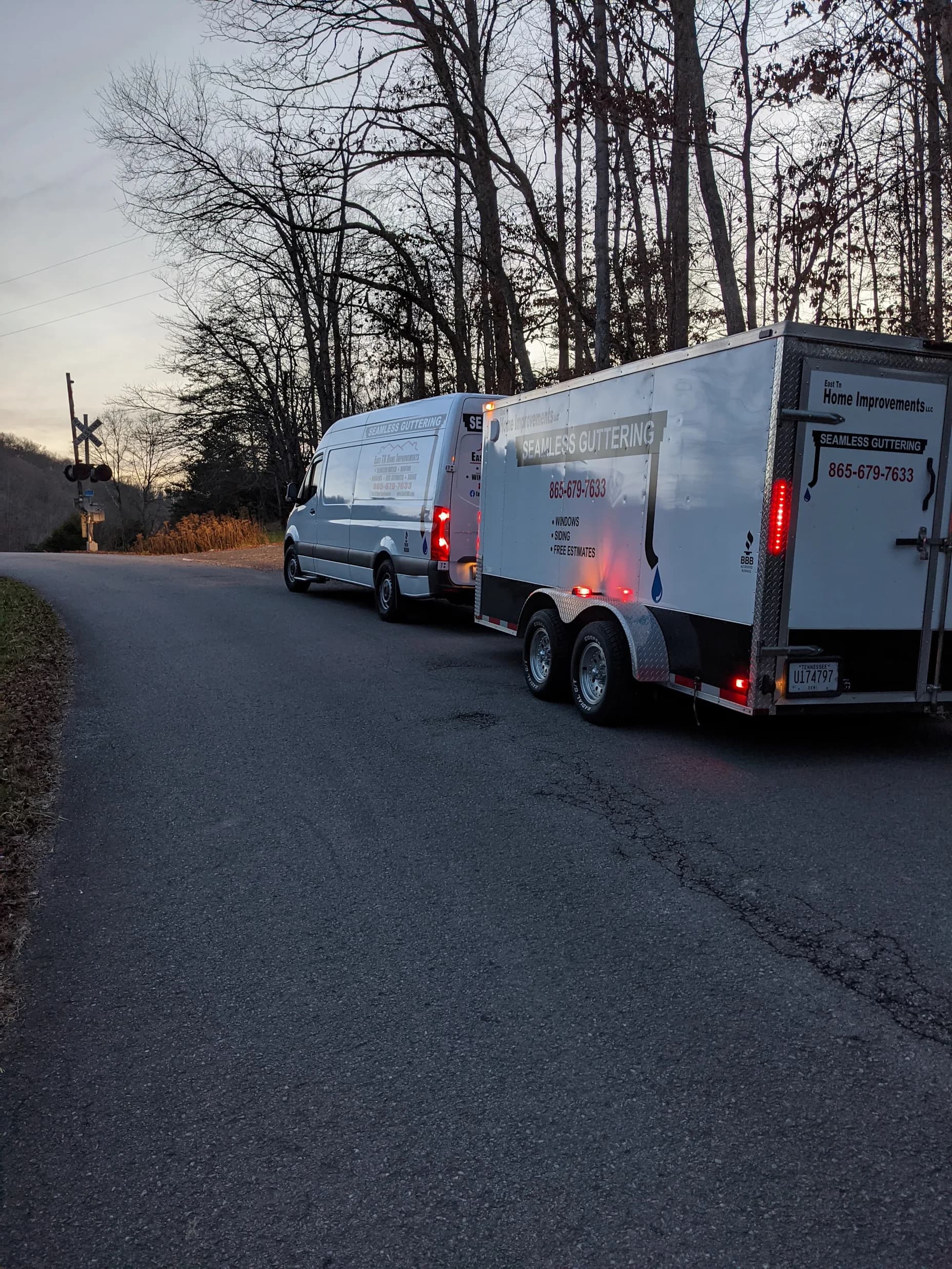 East TN Home Improvements work van and seamless gutter trailer