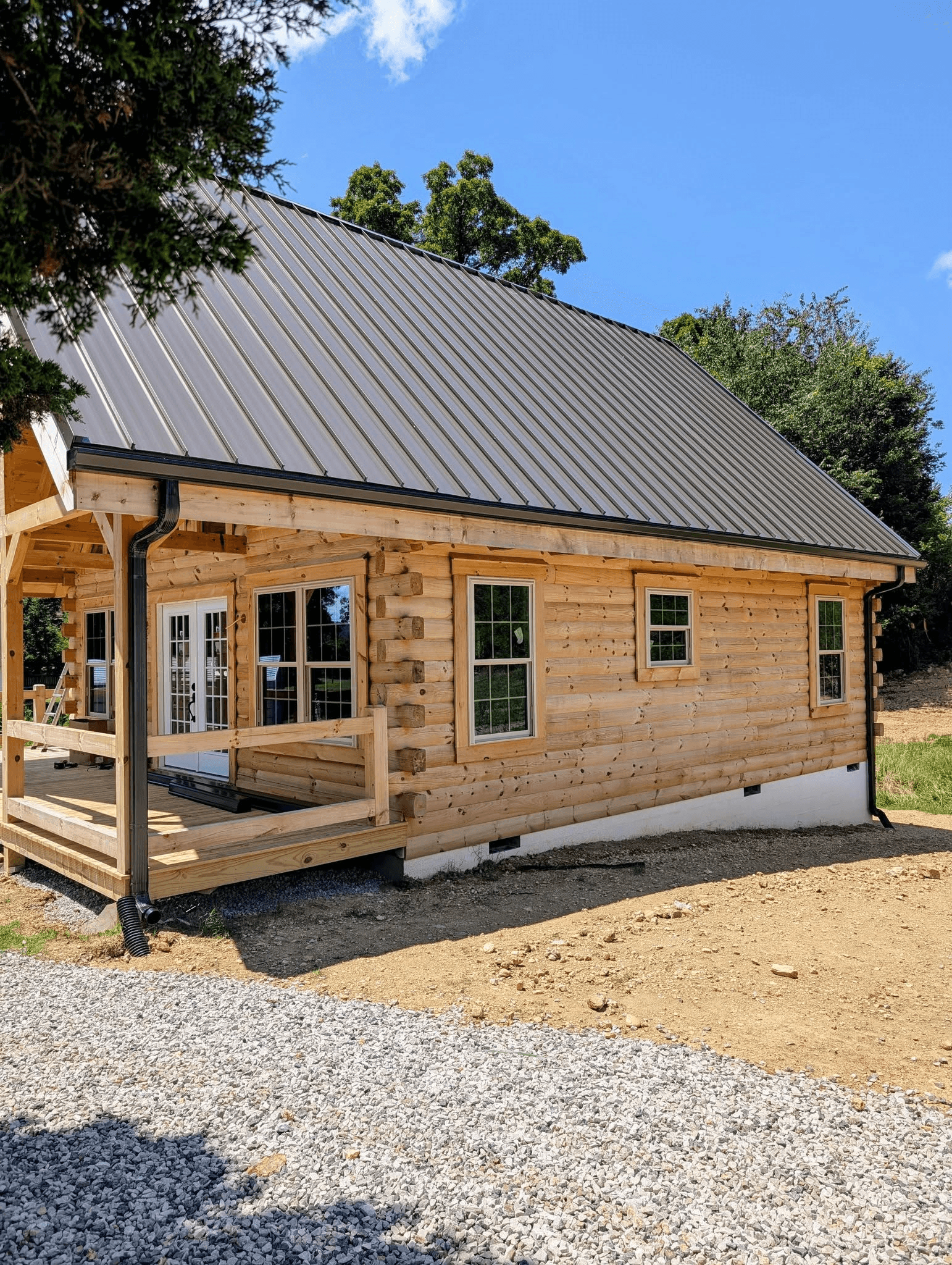 Seamless gutters installed along a log home in East Tennessee